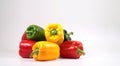 Colorful fresh mixed bell peppers isolated on white Royalty Free Stock Photo