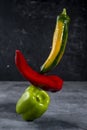 Colorful fresh peppers on gray background template Royalty Free Stock Photo