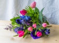Colored spring flower arrangement on table vintage style Royalty Free Stock Photo