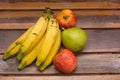 Colorful fresh summer fruits on brown wooden background, healthy organic food on table, detox vitamin nutrition for health care. Royalty Free Stock Photo