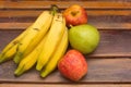 Colorful fresh summer fruits on brown wooden background, healthy organic food on table, detox vitamin nutrition for health care. Royalty Free Stock Photo