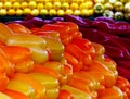 Colorful and fresh sweet yellow and orange bell peppers on display Royalty Free Stock Photo