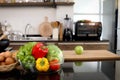 Colorful fresh vegetables salad in a glass cup and food ingredients on table counter kitchen with blurred background of beautiful Royalty Free Stock Photo