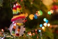 Colorful frosty man ornament in the Christmas tree Royalty Free Stock Photo