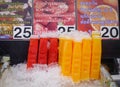 Colorful fruit juice on the cart at street market