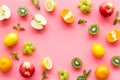 Colorful fruit mockup. Cut apple, kiwi, citrus on pink background top-down copy space Royalty Free Stock Photo