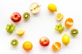 Colorful fruit mockup. Cut apple, kiwi, citrus on white background top-down copy space Royalty Free Stock Photo