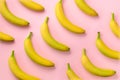 Colorful fruit pattern. Bananas over pink background. Top view. Pop art design, creative summer concept. Minimal flat lay style.