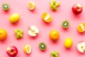 Colorful fruit pattern. Cut apple, kiwi, citrus on pink background top-down Royalty Free Stock Photo