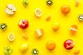 Colorful fruit pattern. Cut apple, kiwi, citrus on yellow background top-down Royalty Free Stock Photo