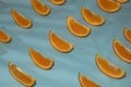 Colorful fruit pattern of fresh orange slices on light blue background top view orange fruit pattern background Flat lay orange Royalty Free Stock Photo