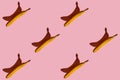 Colorful fruit pattern of fresh yellow bananas on a pink background. View from above. Royalty Free Stock Photo
