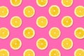 Fruit pattern of lemon slices on a pastel pink background