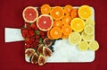 Colorful fruit platter assembly on white marble board with copy space.