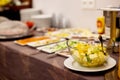 A colorful fruit salad in a clear glass plate sits on the buffet table. Healthy dessert, healthy lifestyle Royalty Free Stock Photo