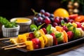 colorful fruit skewers being garnished with mint Royalty Free Stock Photo