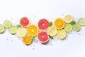 Colorful fruits backround, citrus slices, orange, lemon, lime and grapefruit with ice and mint white background. Top view Royalty Free Stock Photo