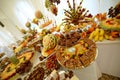 Colorful fruits and cakes on table at a wedding Royalty Free Stock Photo