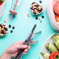 Colorful fresh fruits and vegetables in reusable cotton bags on blue background. Zero waste or responsible food shopping and Royalty Free Stock Photo