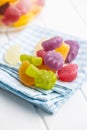 Colorful fruity jelly candies on checkered napkin