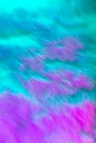 Colorful fur background in purple in blue pink colors