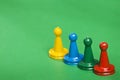 Colorful game pieces - green background Royalty Free Stock Photo