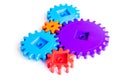 Colorful gears for ideal team work technology white table background top view