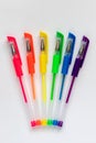 Colorful gel neon rainbow colors pens on white background Royalty Free Stock Photo