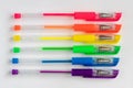 Colorful gel neon rainbow colors pens on white background Royalty Free Stock Photo