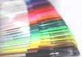 Colorful gel pens laid down in a horizontal row Royalty Free Stock Photo