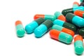 Colorful gelatin pills capsules on white background