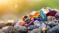 Colorful gemstones on rocky surface with sunlit background Royalty Free Stock Photo