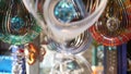 Colorful geometric metallic wind spinner, garden hypnotic surreal decoration, California USA. 3D kinetic rotating iridescent
