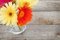 Colorful gerbera flowers on wooden table Royalty Free Stock Photo