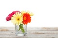 Colorful gerbera flowers on wooden table Royalty Free Stock Photo