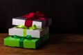 Colorful gift boxes with ribbon bows on a brown wooden background with copy space.Holidays,Christmas, New Year presents Royalty Free Stock Photo