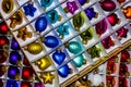 Colorful glass christmas tree balls lying in opened boxes