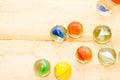 Colorful glass marble on wooden floor Royalty Free Stock Photo