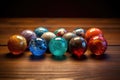 colorful glass marbles on a wooden surface