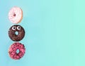 Colorful glazed donuts in motion with funny eyes.