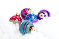 Colorful glitter Christmas balls over white background