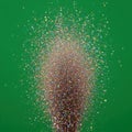Colorful Glitter Explosion on Bright Green Background Royalty Free Stock Photo