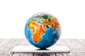 colorful globe on digital tablet isolated