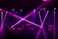 Colorful glow bright spotlights with smoke on stage in dark background, stage concert and music festival show concept Royalty Free Stock Photo