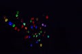 Colorful, glowing Balloons Flying in the Dark Night Sky Royalty Free Stock Photo