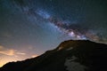 The colorful glowing core of the Milky Way and the starry sky captured at high altitude in summertime on the Italian Alps, Torino Royalty Free Stock Photo