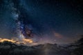 The colorful glowing core of the Milky Way and the starry sky captured at high altitude in summertime on the Italian Alps, Torino Royalty Free Stock Photo