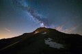 The colorful glowing core of the Milky Way and the starry sky captured at high altitude in summertime on the Italian Alps, Torino Royalty Free Stock Photo