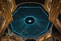 Colorful, glowing, decorative, illuminated glass dome of Vittorio Emanuele II Gallery