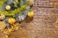 Colorful gold Christmas baubles on pine